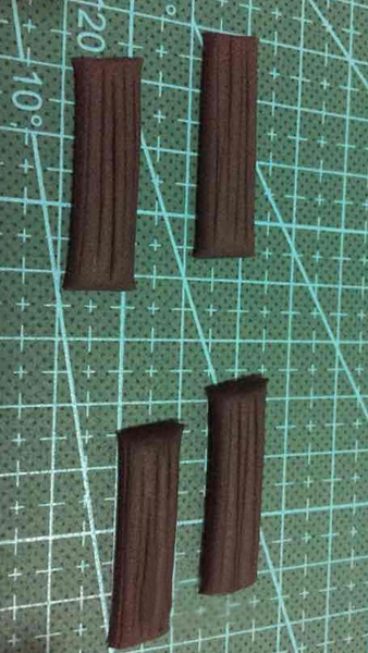 步骤4:搓4块黑色长条，用切刀划出划痕