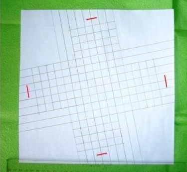 过程7:按图中红线所示方位，向外再折一格，留下折痕即可。
