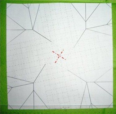 过程19:纸翻到反面，依照已有折痕将纸的基地有些捏起来，如图所示，留下折痕。
