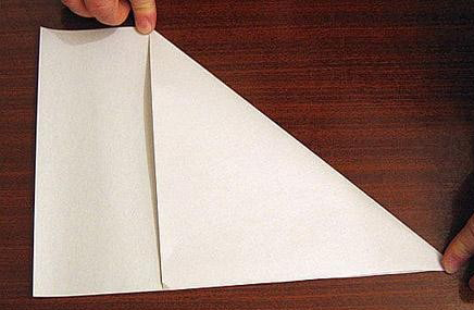 过程1:预备一张长方形白色纸张，如图先折出一个三角形